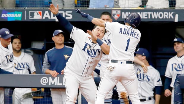 Oct 7, 2019; St. Petersburg, FL, USA; Tampa Bay Rays shortstop Willy Adames (1) celebrates his home run against the Houston Astros with first baseman Ji-Man Choi (26) during the sixth inning in game three of the 2019 ALDS playoff baseball series at Tropicana Field. Mandatory Credit: Reinhold Matay-USA TODAY Sports